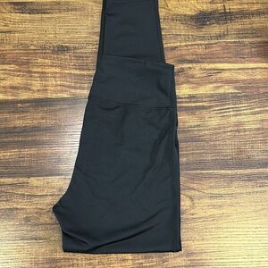 B81 boutique, solid black leggings with exposed knees, size medium